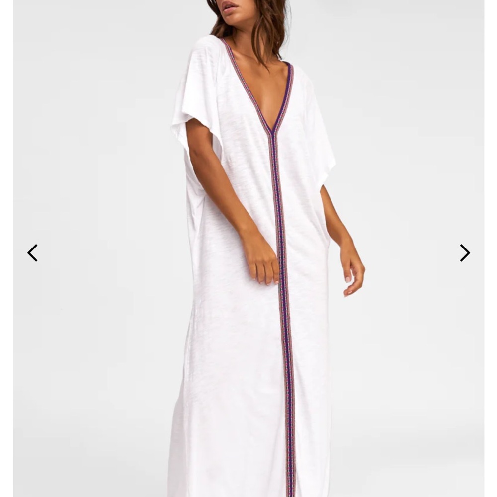 Elegant White Kaftan with Purple Trim.